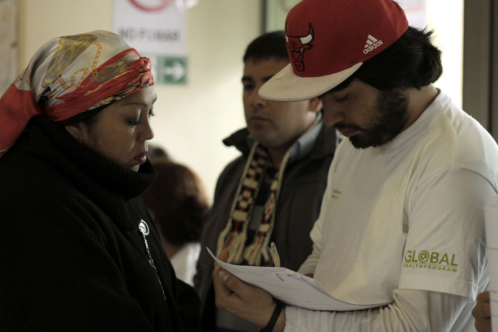 Mapuche healer and a student working together during our fieldwork in Lampa
